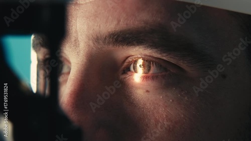Male patient undergoing detailed vision examination with advanced ophthalmic equipment, focusing on eye health and diagnostic procedures in a clinical setting