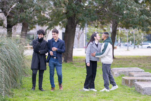 Four millennial friends spending quality time together on a beautiful autumn day