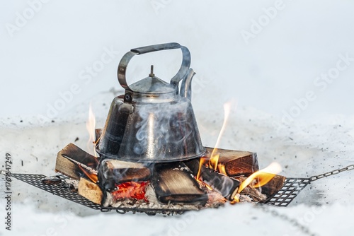 Coffee pot standing on fireplace, water pot, traditional, Sami culture, Jokkmokk winter market, Jokkmokk, Lapland, Sweden