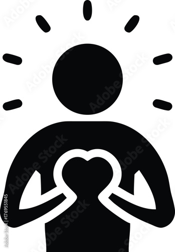 Silhouette of a person with a glowing heart and radiating light