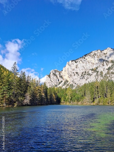 Grüner See in Austria, sparkling in the autumn sunshine, surrounded by mountains, forests and clear water