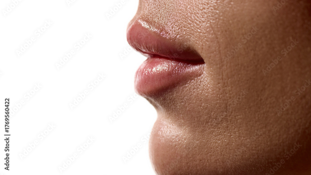 Obraz premium Female lips side view with smooth hydrated surface and natural gloss. Concept of cosmetic surgery aesthetic clinics, beauty skincare, and pharma derma cosmetics