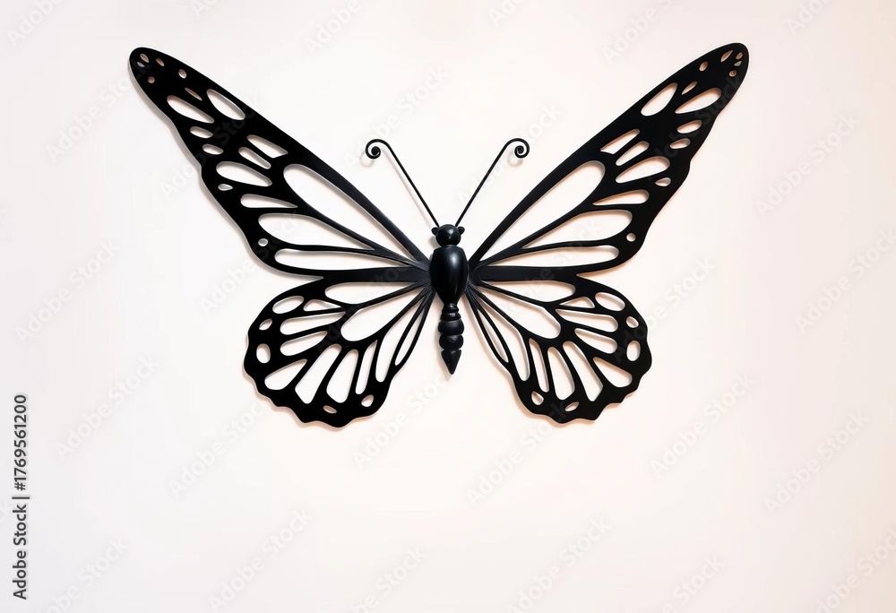 Obraz premium Intricate black metal butterfly silhouette against white background, photo, image