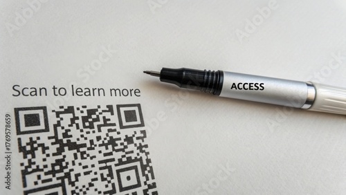 A pen labeled access beside a printed QR code