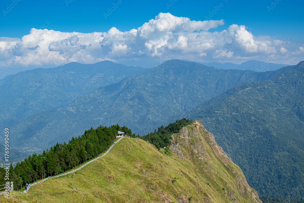 Fototapeta premium Tarey Bhir point,favourite tourist spot, Sikkim,India. A long path on the hills, a breathtaking viewpoint at the end of the edge, tourists get spectacular view of Himalayan mountains in front of them.
