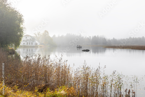 Autumn river in a foggy morning. Farnebofjarden national park in north of Sweden.