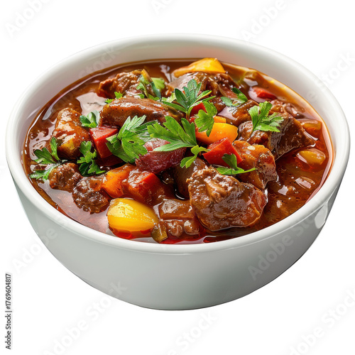 Hearty beef stew with colorful vegetables and fresh herbs in a white bowl, isolated on white background