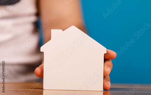 A person's hand gently hold...