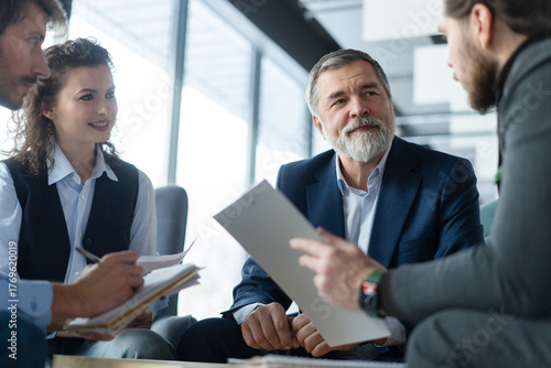 Business people, meeting and discussion with creative team for collaboration, planning or brainstorming at office