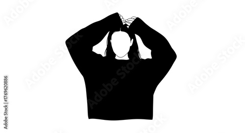 Silhouette of a person with hands framing their face in darkness