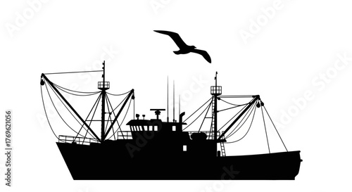 A striking silhouette of a fishing boat with a soaring seabird above