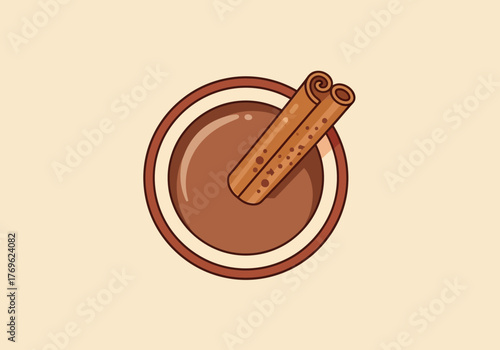 A top-down view of a warm, comforting mug of hot chocolate with a cinnamon stick.