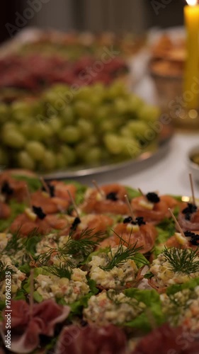 Beautifully served banquet table with different food snacks and appetizers.