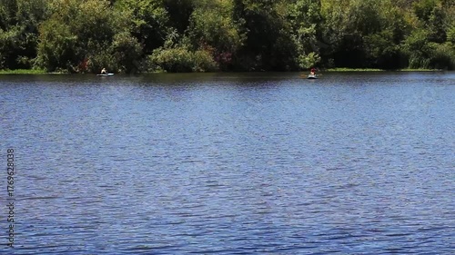Two Kayaks On Distant Side Of Lake With Green Trees Santa Rosa California
