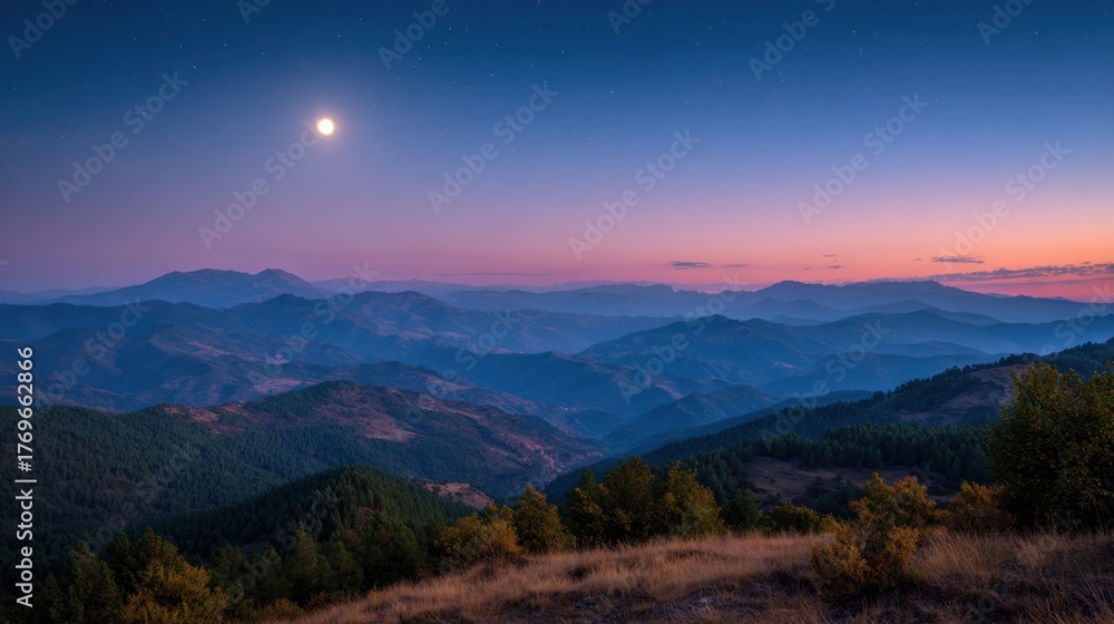 Naklejka premium A tranquil scene unfolds as the moon rises above rolling hills illuminating the serene valley below.