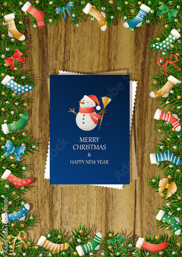 A wooden vertical surface decorated with Christmas decorations, a holiday card lies on the table, creating a warm festive atmosphere