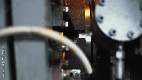 Automated production of uniform helical grooves on polished steel, metal hoses