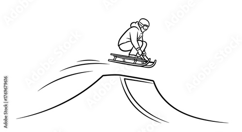 Person sledding down a hill while jumping off a ramp in winter  