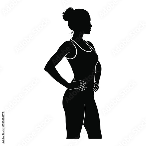 Silhouette of a fit woman standing confidently with hands on hips silhouette