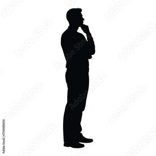 Silhouette of a thoughtful man standing and posing with his hand on his chin silhouette