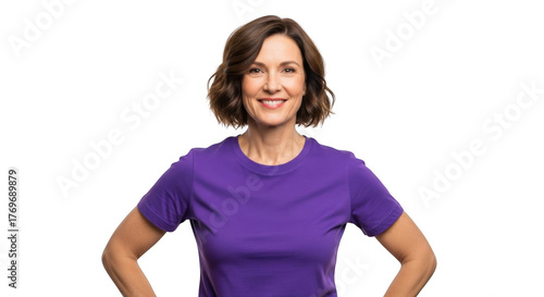 Smiling middle aged woman with short brown hair wearing a purple t shirt standing with hands on hips isolated on transparent background