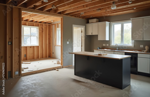 Interior view showcases home under construction. New kitchen installed. Wooden frame, exposed beams create rustic ambiance. Contractor renovating house adding features, fixtures, updating design.