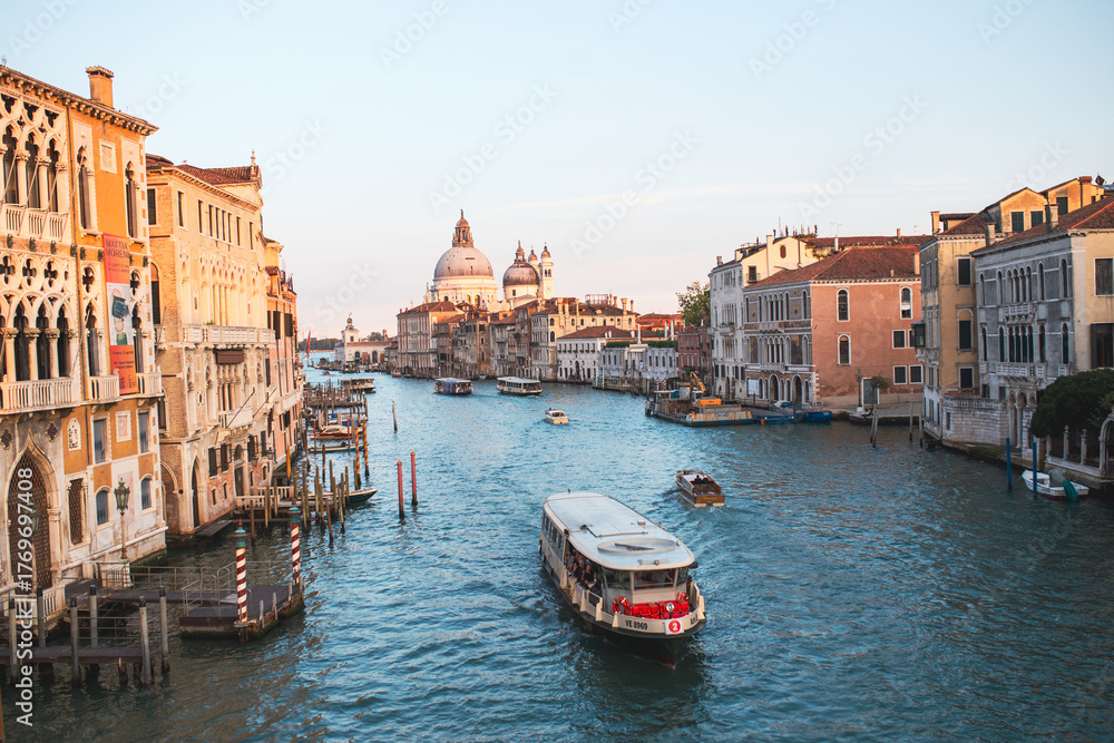 Fototapeta premium Venice Canal View, Romantic Italian Cityscape with Gondolas and Historic Architecture