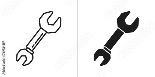 Line art and solid black silhouette of a wrench