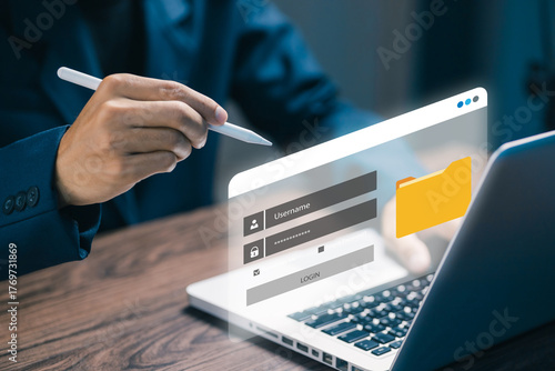 Close-up of a business person using digital pen with virtual login interface on laptop. Concept of cybersecurity, online account access, data protection, and secure authentication.