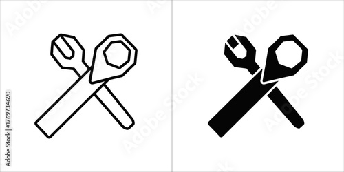 Two icons of crossed wrenches, one outlined and one solid black