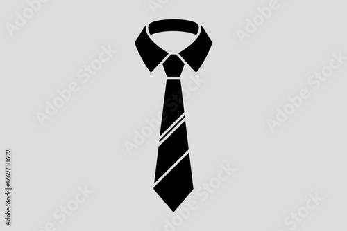 A black tie is worn on a white collared shirt.