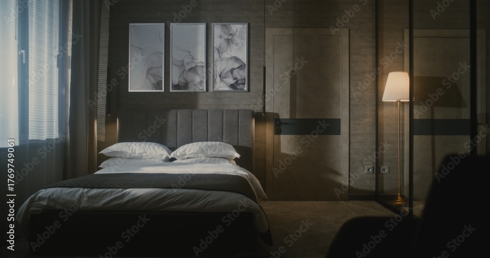 Obraz premium Elegant Mature Hotel Manager in Formal Suit Inspects Luxury Hotel Room, Using Tablet Photograph and Evaluate Bed Arrangement. Concept Hospitality Standards, Quality Control, Professional Management.