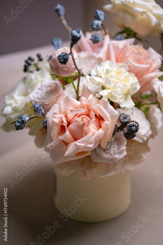 Spring bouquet of mixed flowers on vintage gray wall background behind