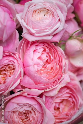 Spring bouquet of mixed flowers on vintage gray wall background behind