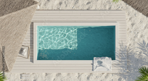 Aerial top down view of a luxury swimming pool on a sandy beach, concept of summer vacation and travel.