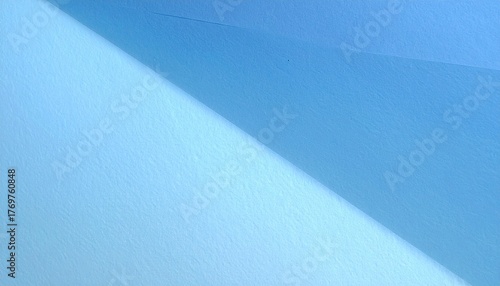 Seamless sky blue paper texture featuring a smooth matte surface and gentle light gradient, creating a soft, calming background ideal for printing, graphic design, packaging, crafts, or digital wallpa