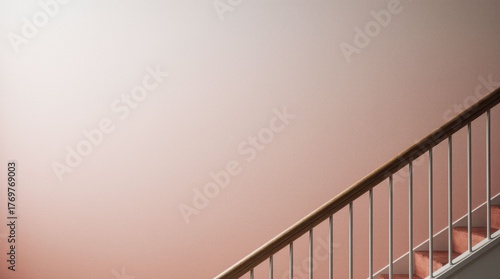 Minimalist staircase with pink ombre painted wall