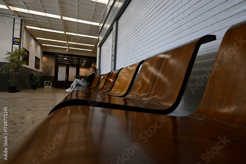 Woman seated alone in small airport.