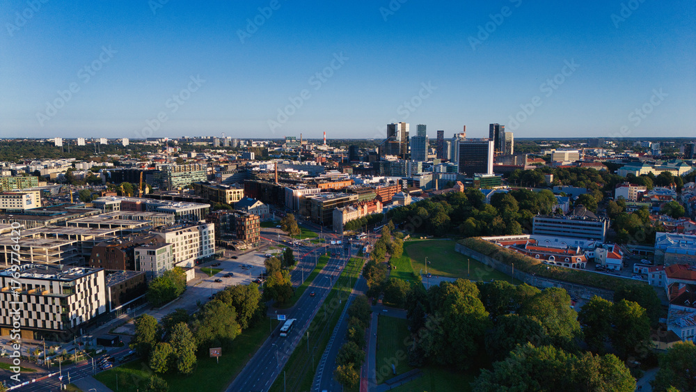 Fototapeta premium Tallinn's Modern Cityscape and Urban Infrastructure at Golden Hour, Aerial View