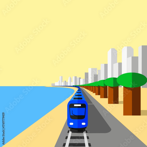 A blue train travels along a coastal railway track with an ocean view and a city skyline in the background, featuring a row of green trees.