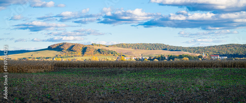 Bild auf Leinwand Soft autumn light over the Mureș valley fields near Târgu Mureș, Transylvania, under drifting clouds