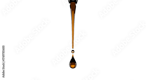 A single, perfect drop of golden amber liquid, possibly honey or oil, suspended in mid-air against a stark black background, showcasing its viscous texture and reflective surface with a smaller