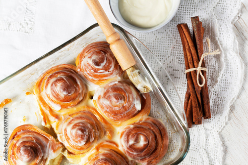 Cinnabons, cinnamon rolls topped with a cream of cream, cheese and sugar.