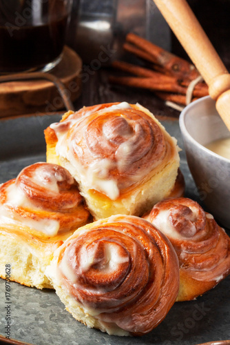 Cinnabons, cinnamon rolls topped with a cream of cream, cheese and sugar.