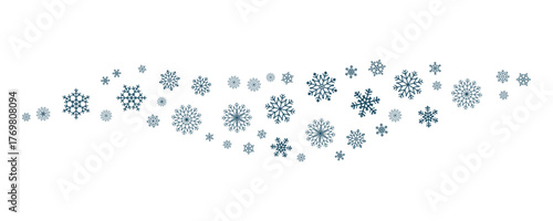 Small wave accent of navy snowflakes. Minimalist frosty winter detail for seasonal cards, graphics and holiday visual projects