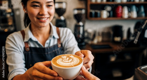 A smiling barista serving latte art in a cafe with equipment, perfect for coffee shop advertising, barista training materials, and cozy cafe culture themes.