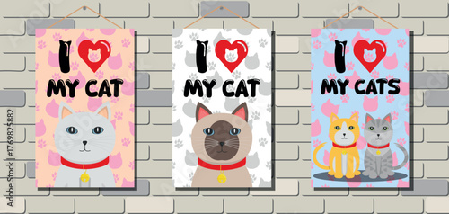 Set of Decorative Cat Posters Hanging on White Brick Wall - I LOVE MY CATS - White, Siamese and Two Cats Version on Pink, White and Blue Backgrounds.