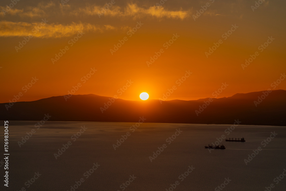Fototapeta premium Greece, Peloponnese, Kalamata - 3 April 2024 - Spectacular and evocative sunset in Kalamata, Greece