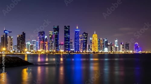 Wallpaper Mural Doha Skyline at Night with Illuminated Skyscrapers Reflected in the Water. Torontodigital.ca