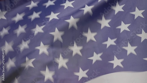 Against vast expanse of sky, US national flag and LGBT Rainbow Flag fly side by side. American flag embodies freedom and democracy, while Rainbow flag celebrates love and acceptance for all people